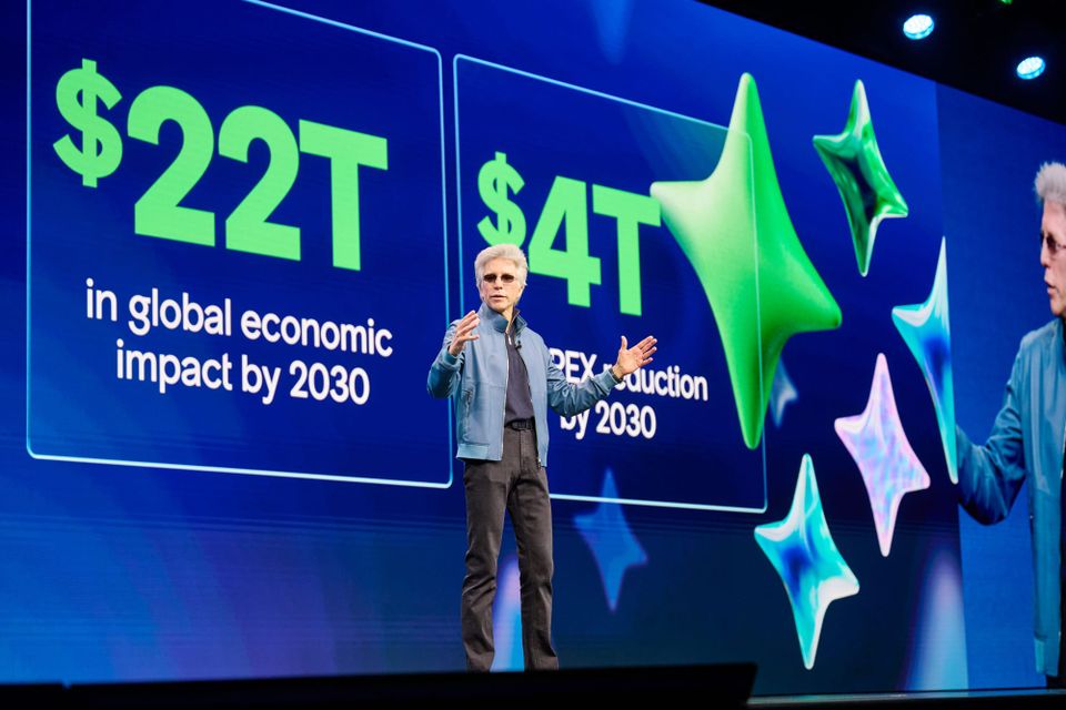 ServiceNow CEO Bill McDermott speaks at Knowledge 2025 in front a a slide explaining the impact agentic AI will have on the economy.