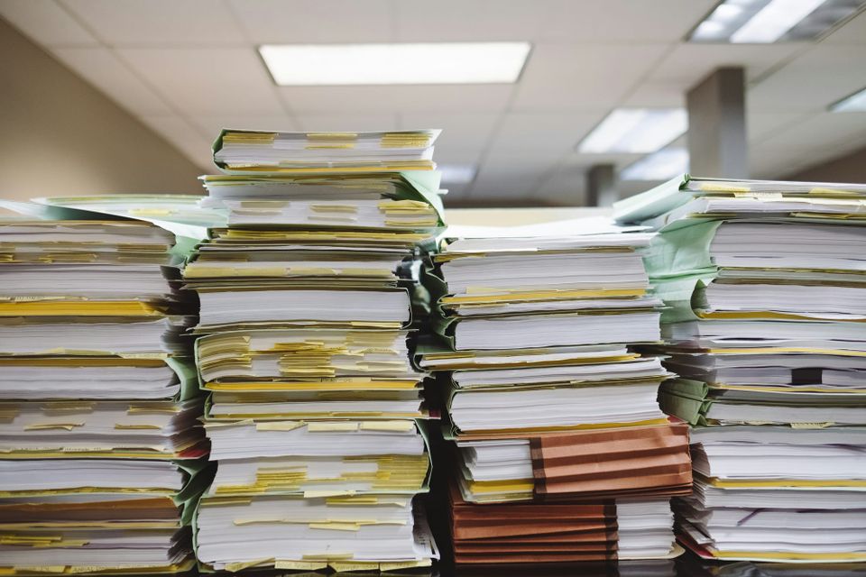 A stack of documents, the UK government said it plans to use its Consult tool to analyse thousands of consultation responses