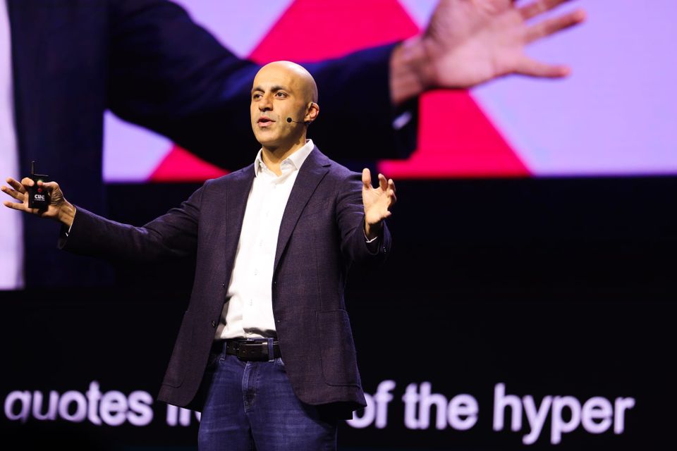 Databricks CEO Ali Ghodsi speaks on stage at the 2025 Data & AI Summit.