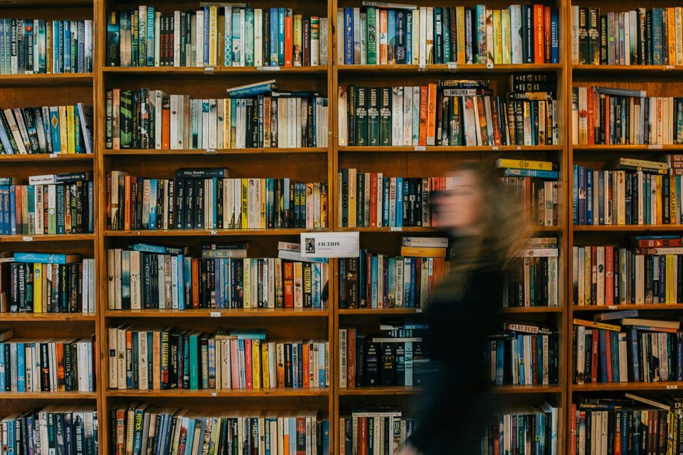 A person walks past a bookcase but they are blurry, AI hallucinations may be getting worse data shows
