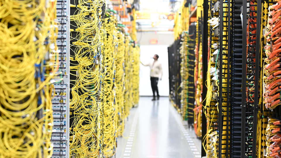 Cables connect servers inside racks within an AWS data center