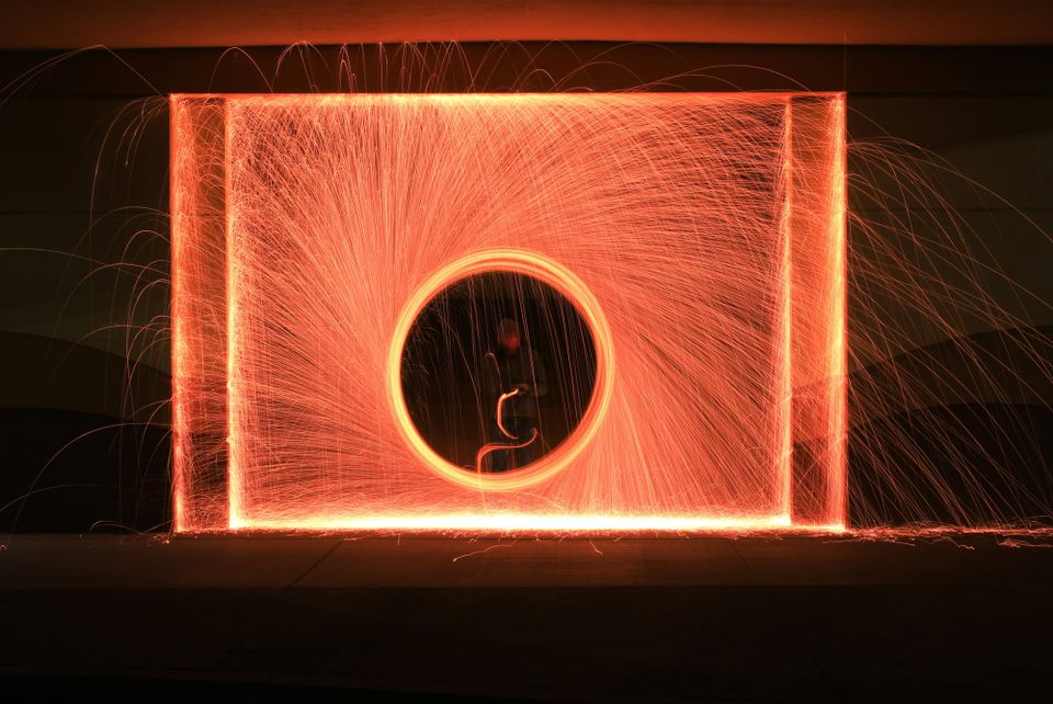 A person stood in the centre of a block of light made to look like a portal using long-exposure photography. Startup Portal26 raised nine million dollars this week.