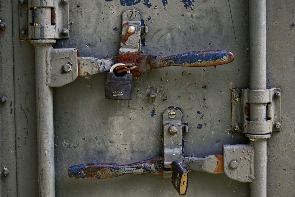 Two locks and safety latches covered in Rust. Android is using Rust for memory safety gains.