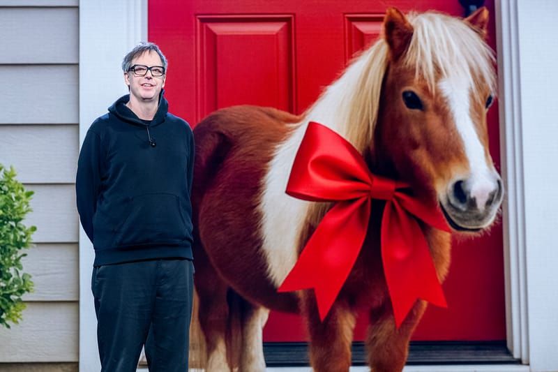 AWS's Byron Cook speaks at re:Invent 2025 in front of a slide with a pony wearing a christmas bow