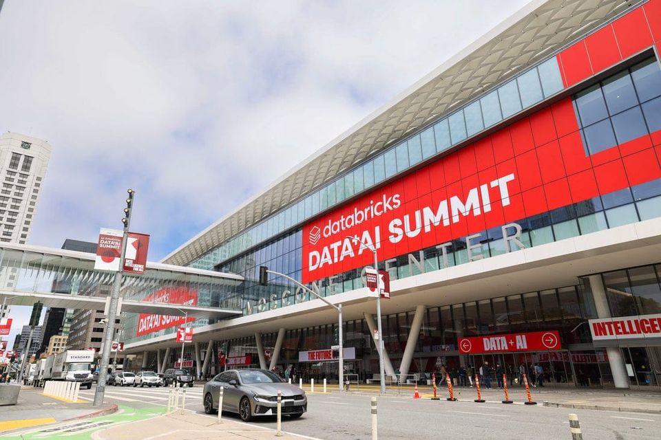 An external shot of Mosocone South in San Francisco with signs promoting the 2025 Databricks Data&AI Summit.