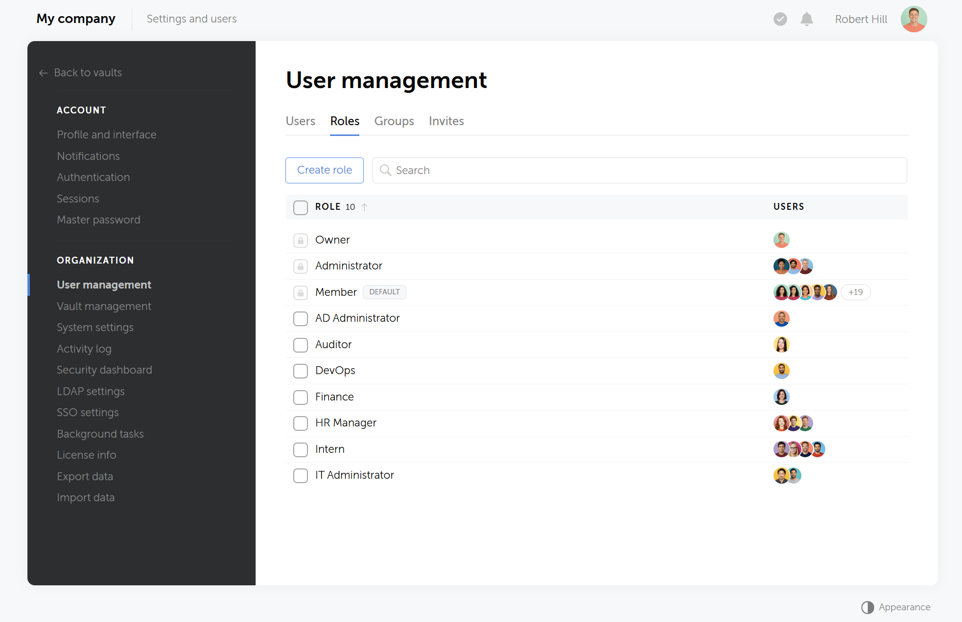 Passwork user management interface showing role-based access control with custom roles for departments and job functions
