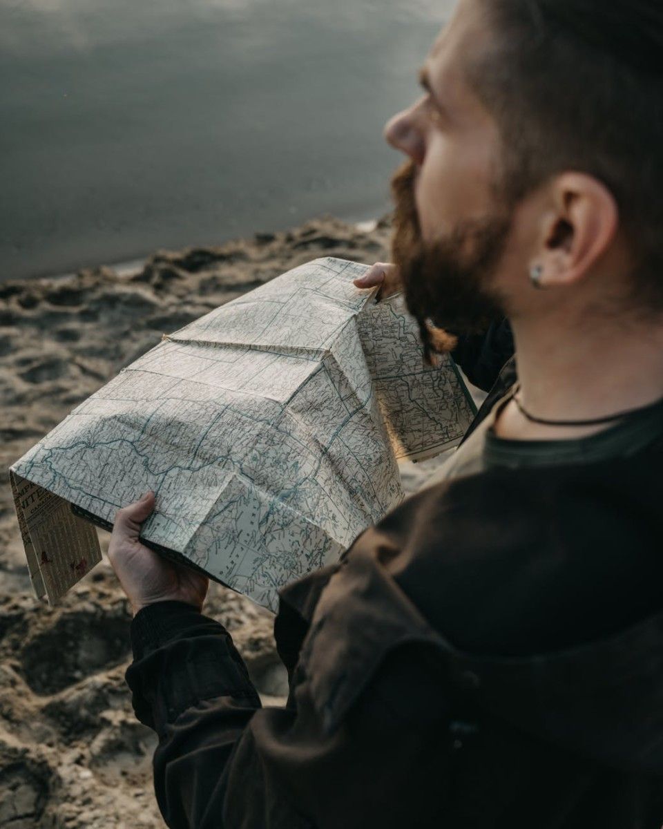 close up shot of a man holding a map