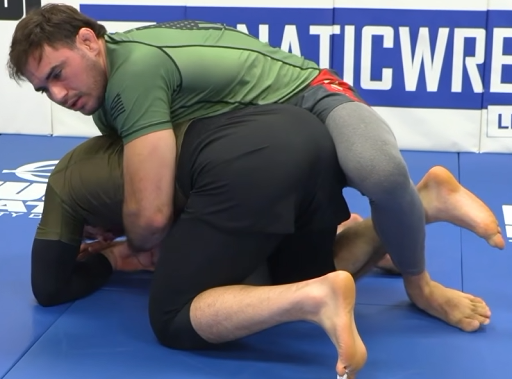 Front headlock go behind