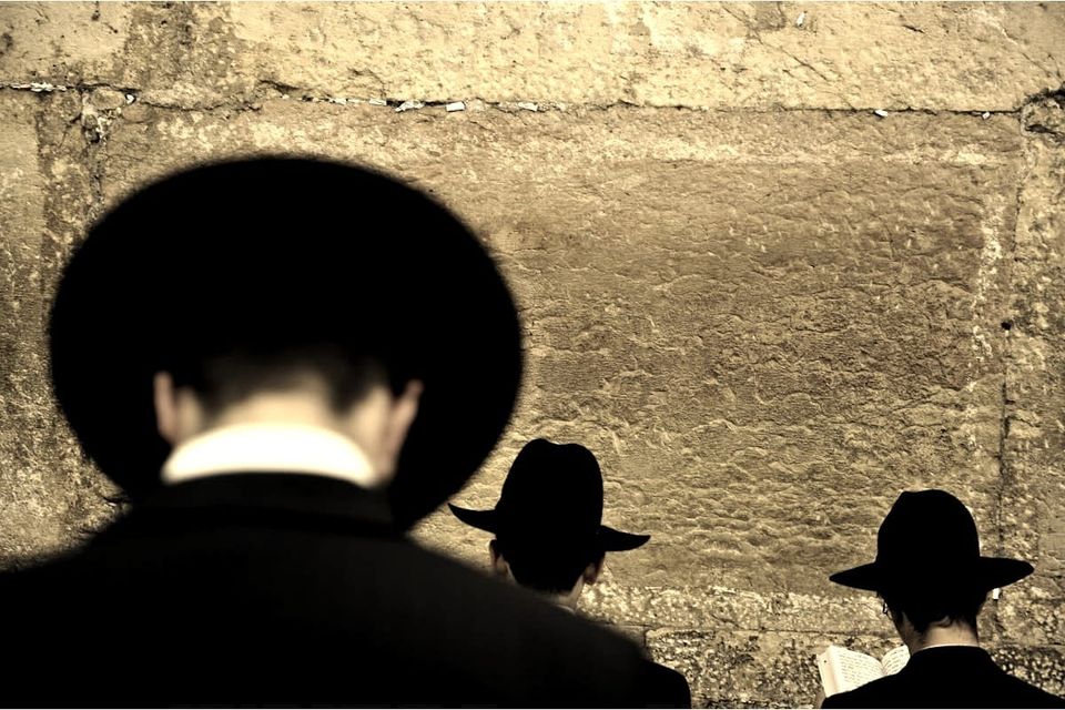 Why Do Charedim Wear Black Hats and Jackets for Davening (Prayers)?