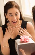 Man giving woman gift.