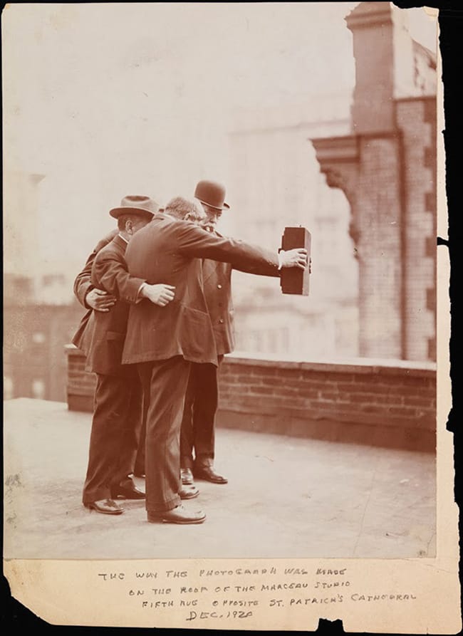 Historial photograph of men taking self photo ie selfie