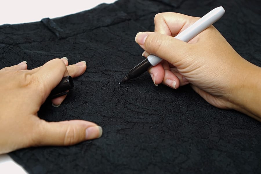 Cookies & Clogs | See how my quick fashion fix for saving my black pants resulted in me discovering a tip on how to remove permanent marker ink on our laminate table top using Clorox cleaner with bleach.