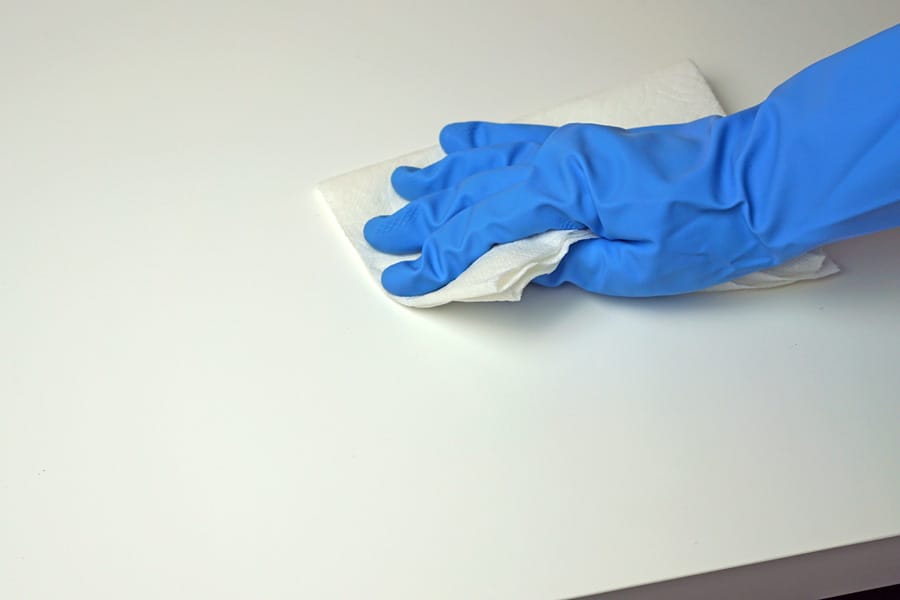 Cookies & Clogs | See how my quick fashion fix for saving my black pants resulted in me discovering a tip on how to remove permanent marker ink on our laminate table top using Clorox cleaner with bleach.