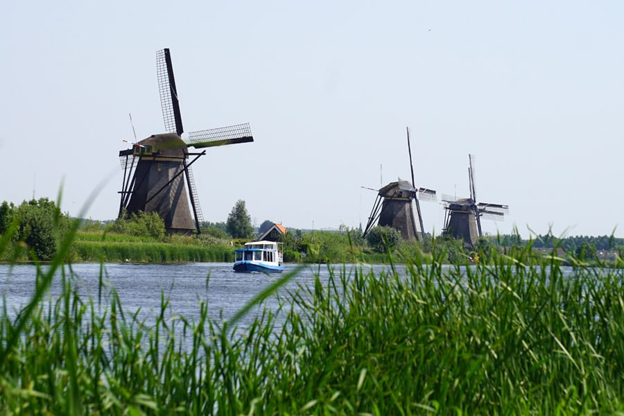 Cookies & Clogs | When visiting the Netherlands aka Holland, traditional Dutch windmills are a must-see. Kinderdijk is one of the best places to view these and with numerous photo opportunities. It is a UNESCO World Heritage site with 19 windmills.