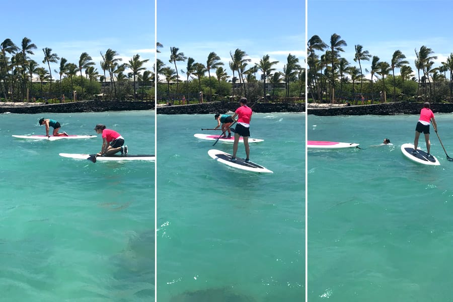 Cookies & Clogs | Oceans Sports Aloha Days offer 4 hours of unlimited water sports beach equipment including kayaks, stand-up paddleboards, snorkel gear, and rides on the glass bottom boat. One of the many things to do on the Big Island of Hawaii with kids. Falling off a paddleboard