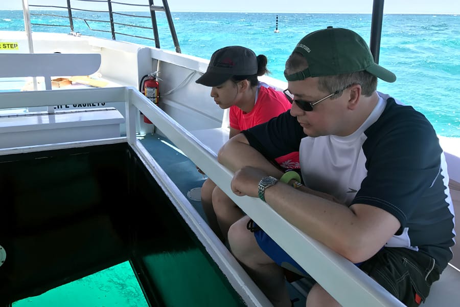 Cookies & Clogs | Oceans Sports Aloha Days offer 4 hours of unlimited water sports beach equipment including kayaks, stand-up paddleboards, snorkel gear, and rides on the glass bottom boat. One of the many things to do on the Big Island of Hawaii with kids. Glass bottom boat