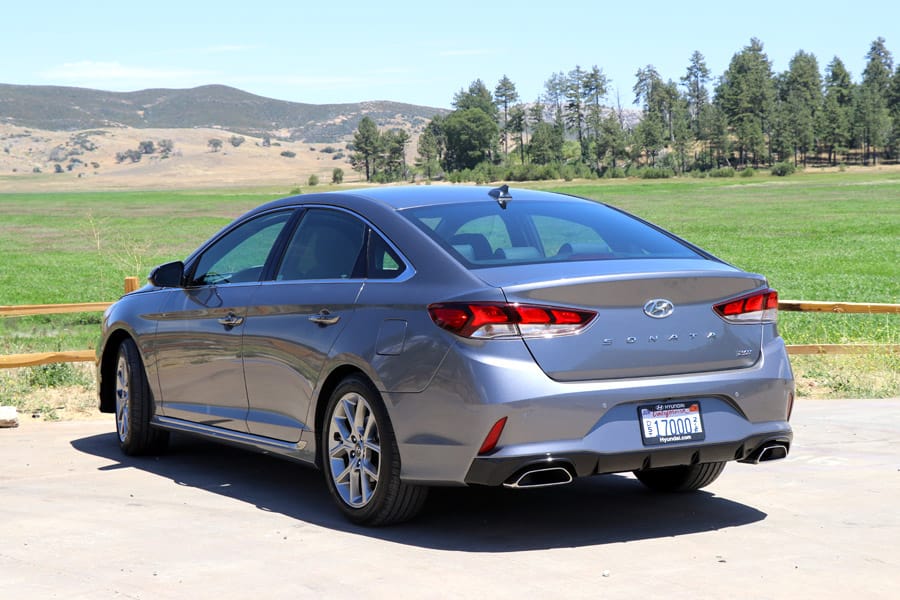 2018&nbsp;Hyundai Sonata Sport dark gray sedan / car in field, back view