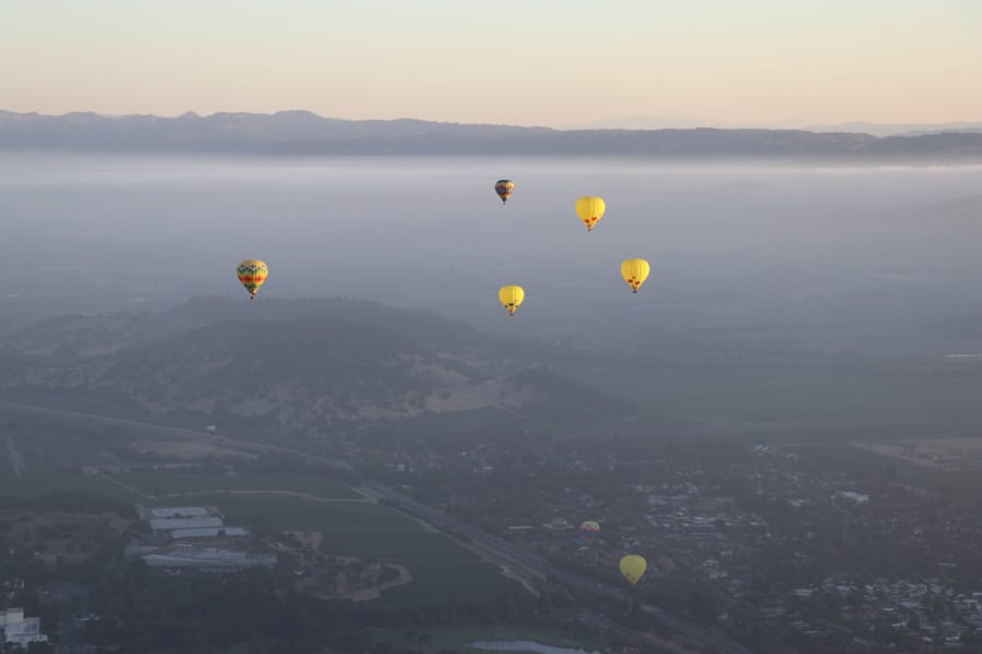Hot air balloon ride over Napa Valley California slow ascension