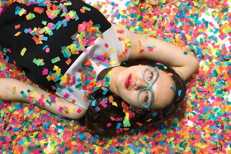 Color Factory in San Francisco, CA. Teen girl with confetti.