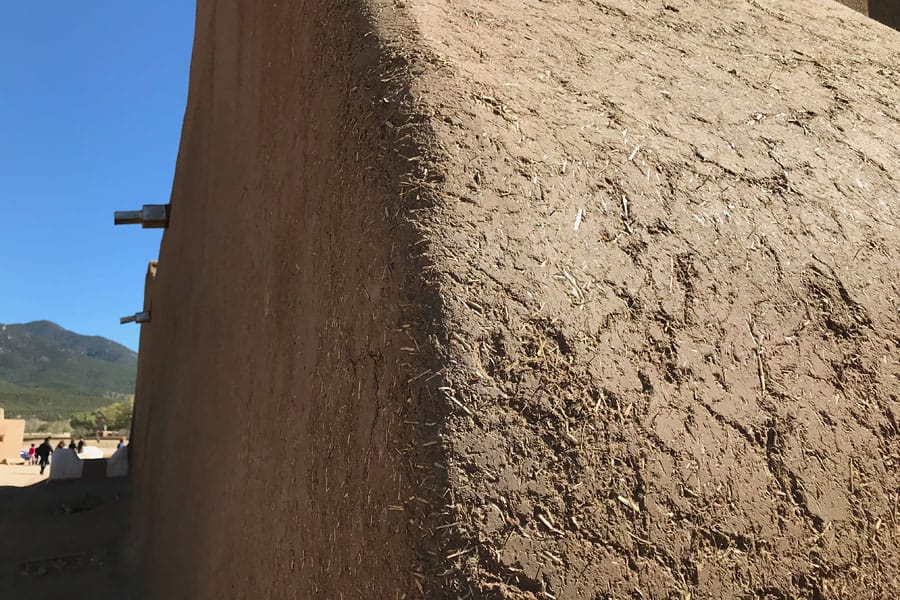 Taos Pueblo New Mexico Road Trip Travel Tips adobe pueblo with mud and straw