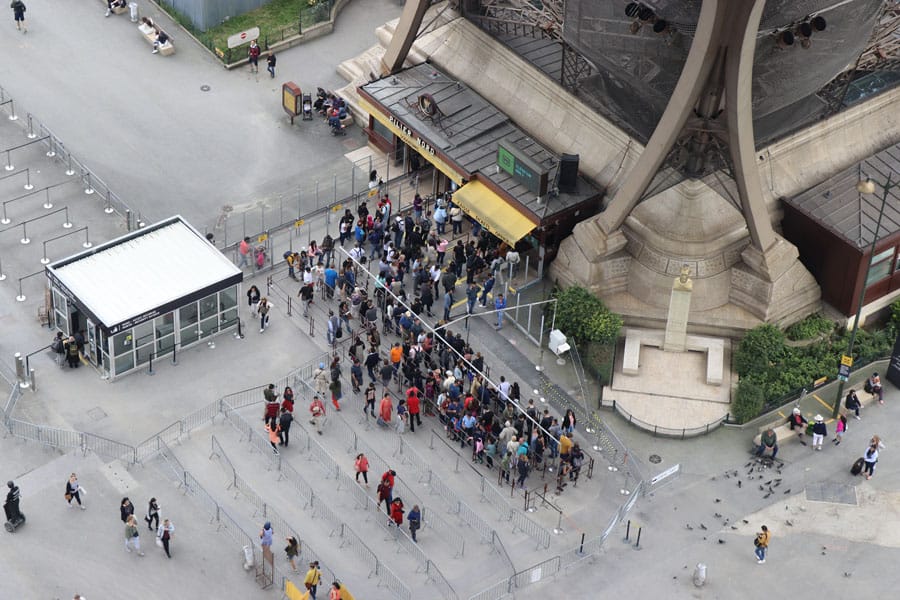 Paris Travel Guide: Top tips for how to visit the top of the Eiffel Tower in Paris France Ticket booths overview from the first floor