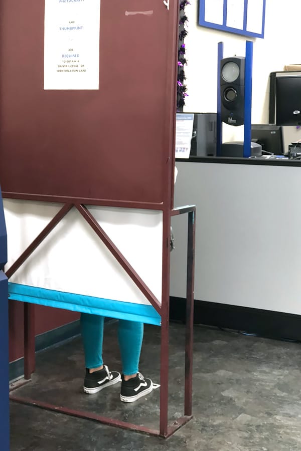Teenage Drivers — Tips for How to Get a Driver Permit at the DMV taking a photo