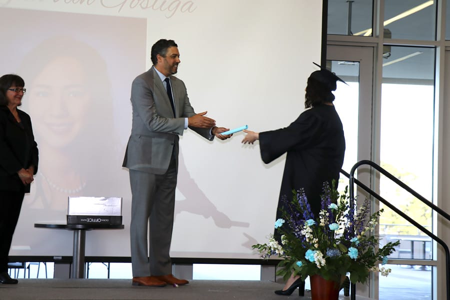 My daughter's high school graduation with photos of the ceremony — Class of 2019 plus her journey from homeschool to high college program; student getting diploma