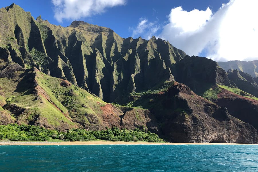 Top things to do in Kauai Hawaii — Kauai Napali Coast boat tour / Na Pali Coast sunset cruise