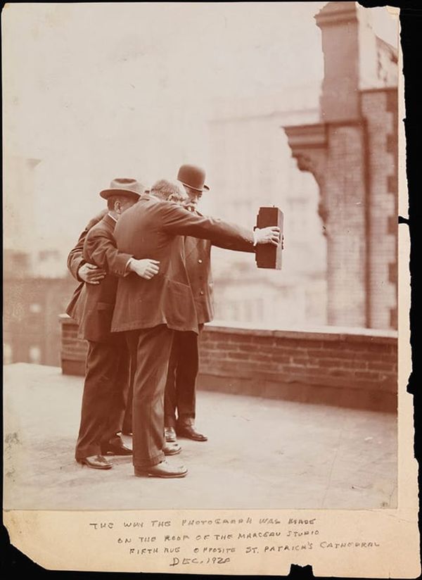 Historial photograph of men taking self photo ie selfie