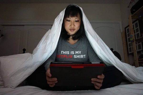 Cookies &amp; Clogs | Multimedia | Mom doing the Netflix Sneak under the covers.