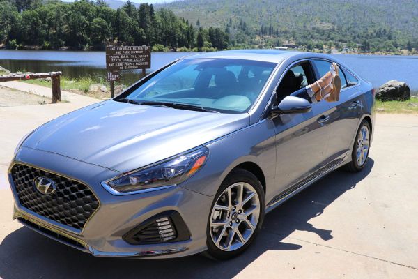 2018 Hyundai Sonata - sedan near water with feet sticking out window