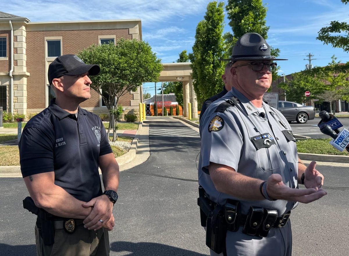 Multiple agencies are on the hunt for armed robber who shot dead two Berea bank employees