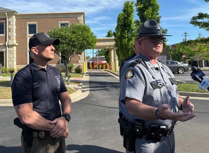 Multiple agencies are on the hunt for armed robber who shot dead two Berea bank employees