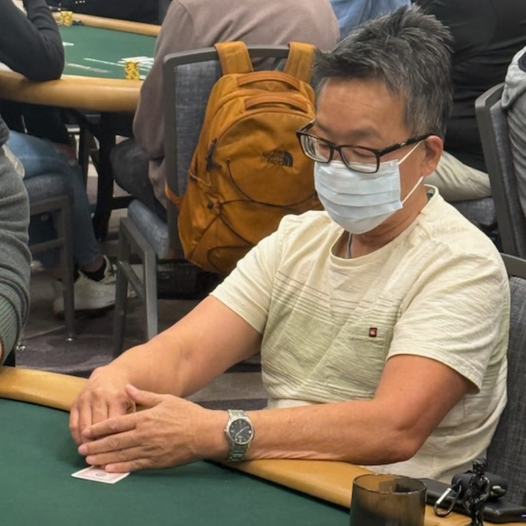 Chino Scott-Chung stays focused during Day 1b of the 2025 WSOP Monster Stack at the Horseshoe, masked and ready for action.