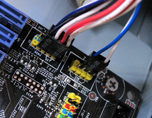 PC build, closeup of motherboard front panel connectors