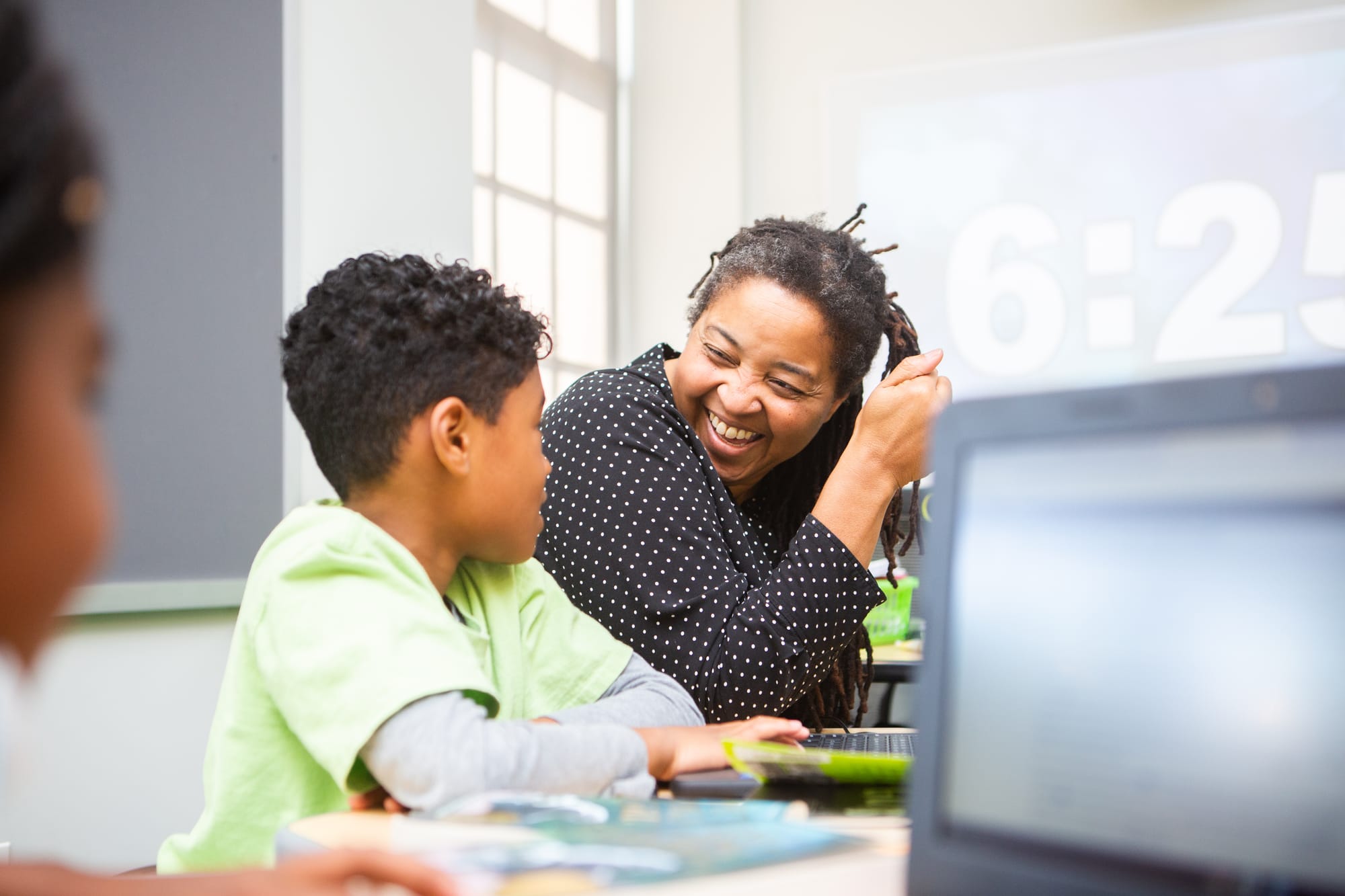 Teacher smiling with student