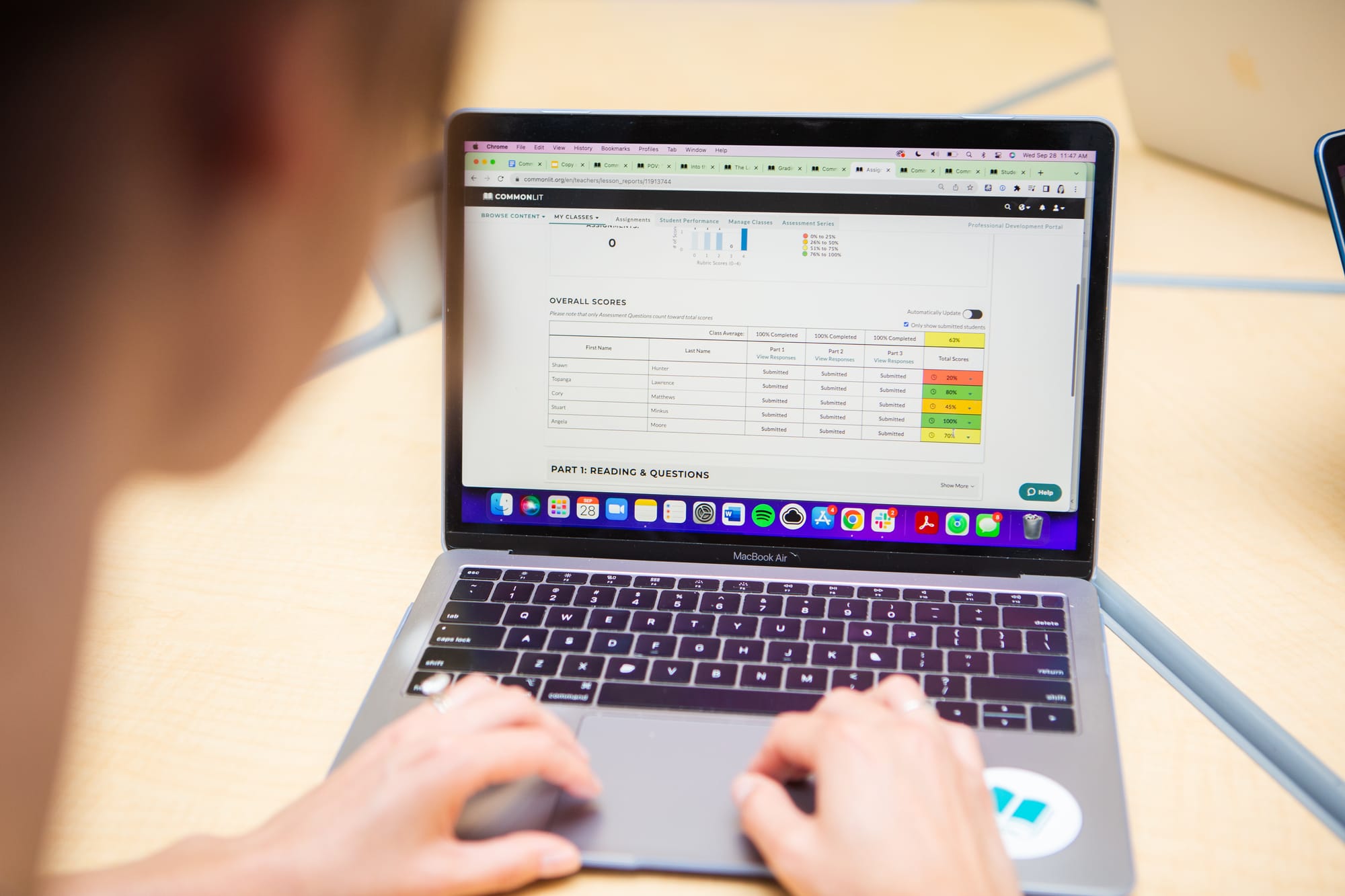 Image of a teacher looking at student growth through CommonLit 