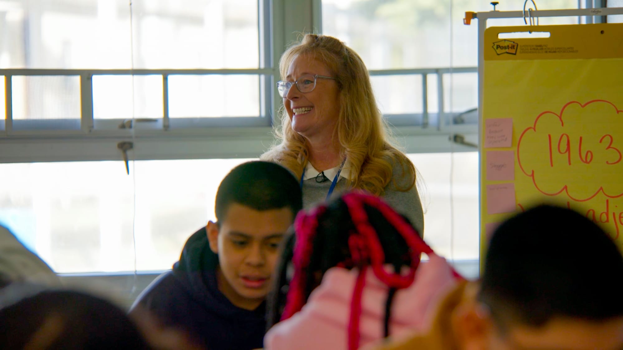 Jennifer Fuller watches students collaborate during her 7th grade ELA class using CommonLit 360.
