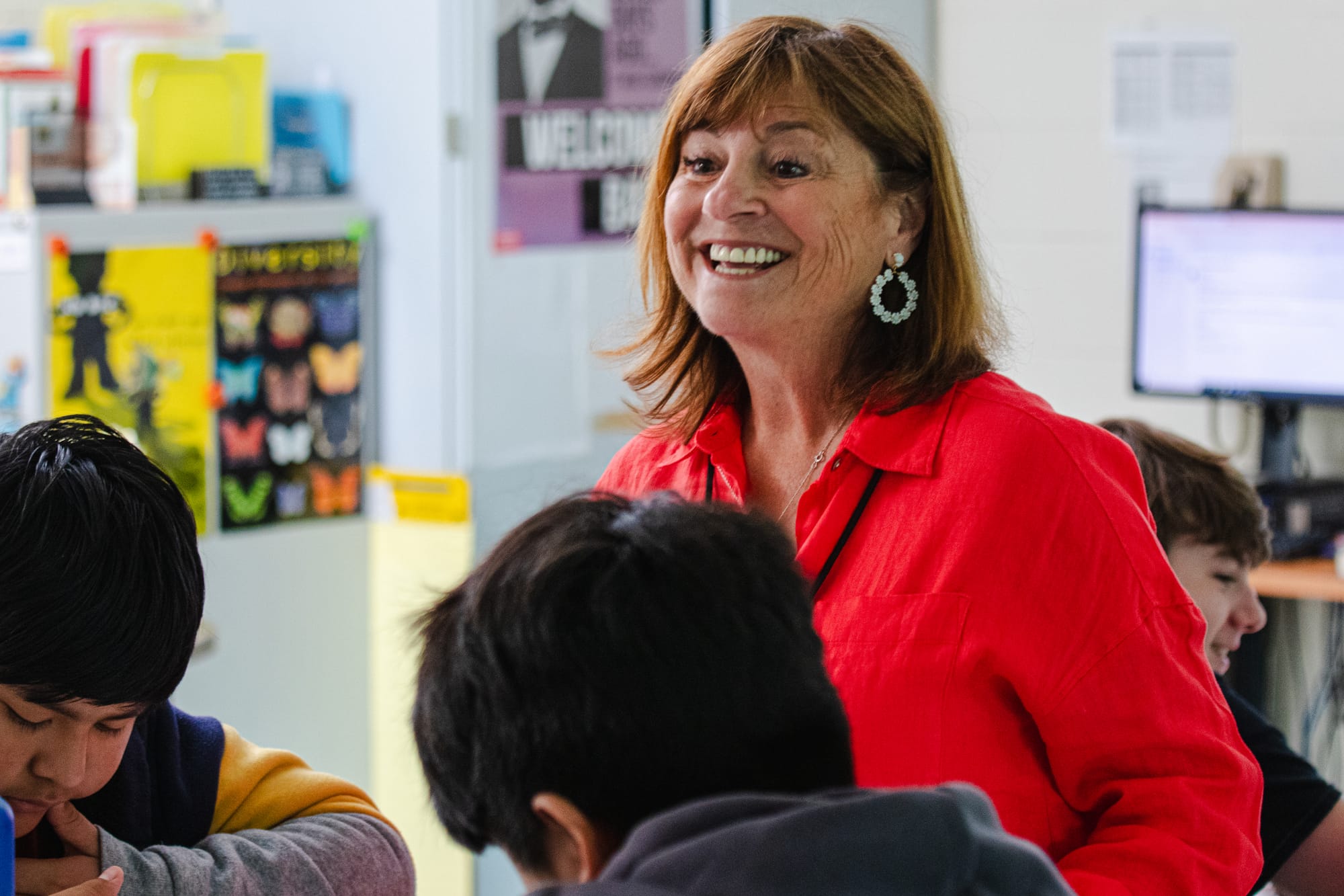 A middle school teacher smiling while teaching a CommonLit 360 lesson.