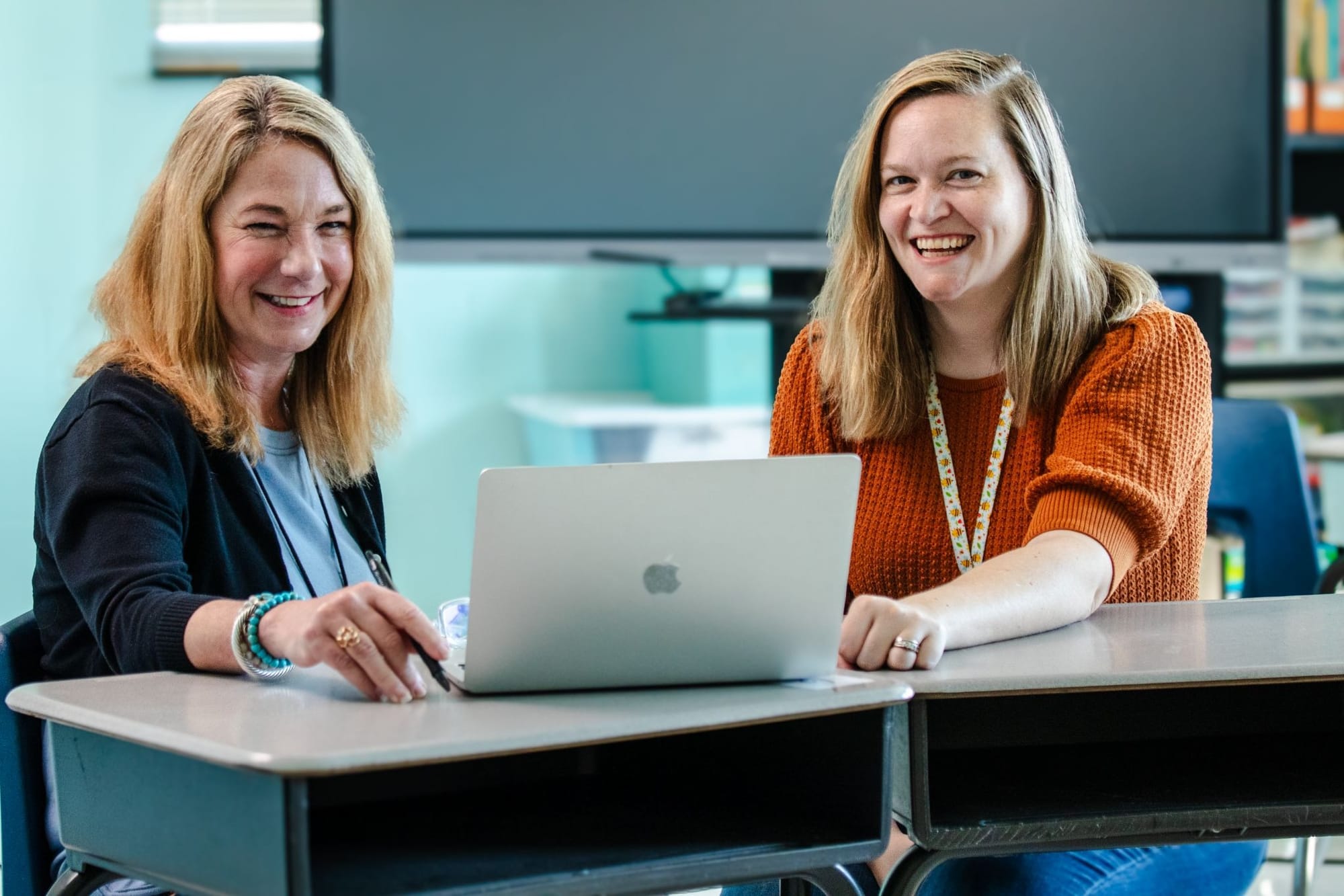 Two teachers completing on-site professional learning with CommonLit.