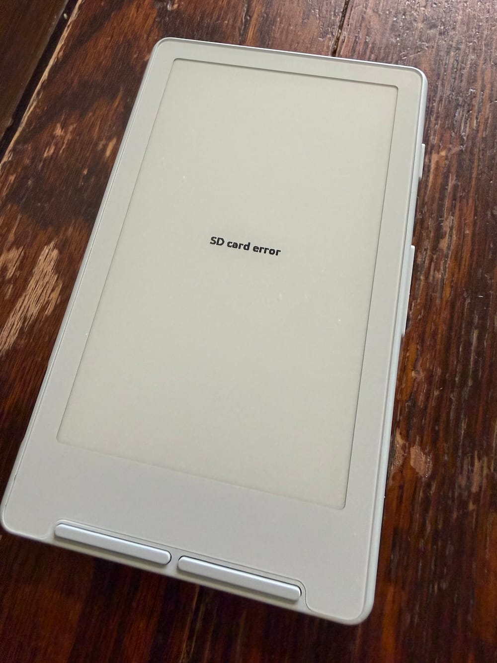 Eink device with "SD card error" message on screen.