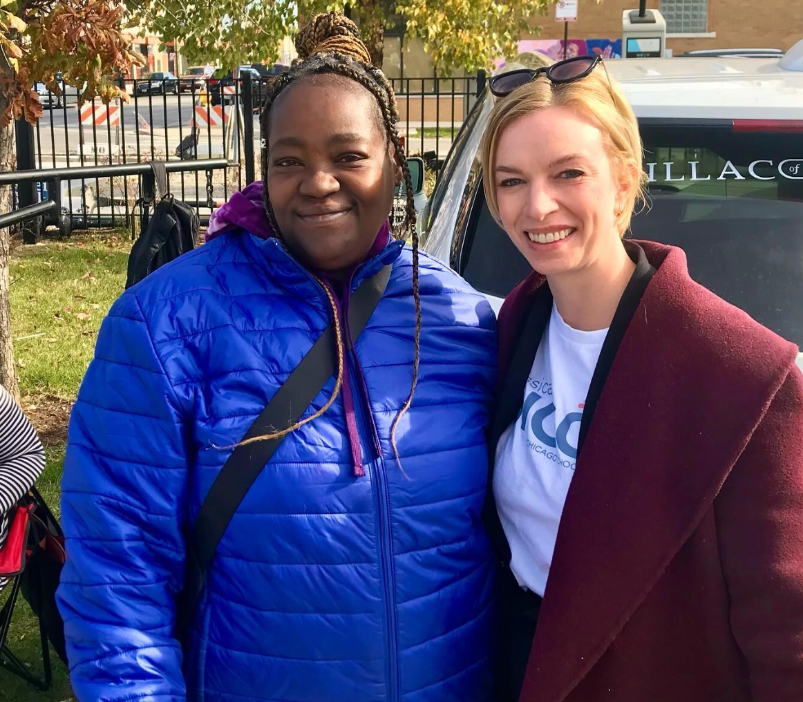 Two women stand next to each other. Jessica Biggs is on the right.