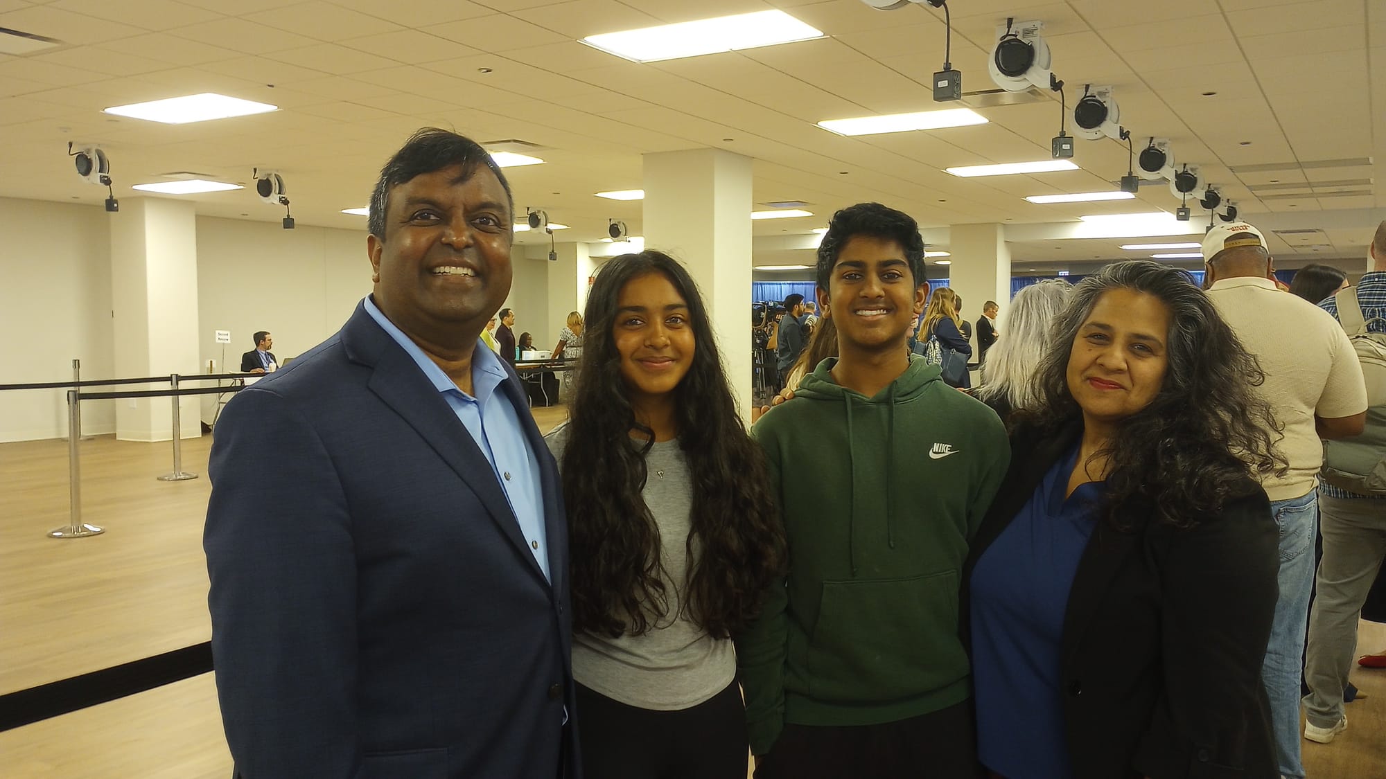 Four people stand together: Sendhil Revuluri, daughter, son, and wife Venu Gupta.