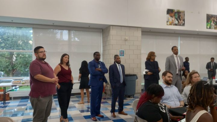 School board members and CPS officials, including Interim CEO Macquline King, listen to community members.