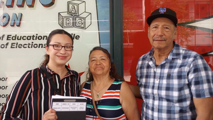 The image shows three people: Yesenia Lopez (sitting board member for district 7B), her mom, and her dad in a trucker hat.