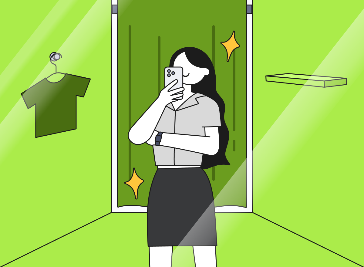 한 여성이 피팅룸 안에서 셀카를 찍고 있다.