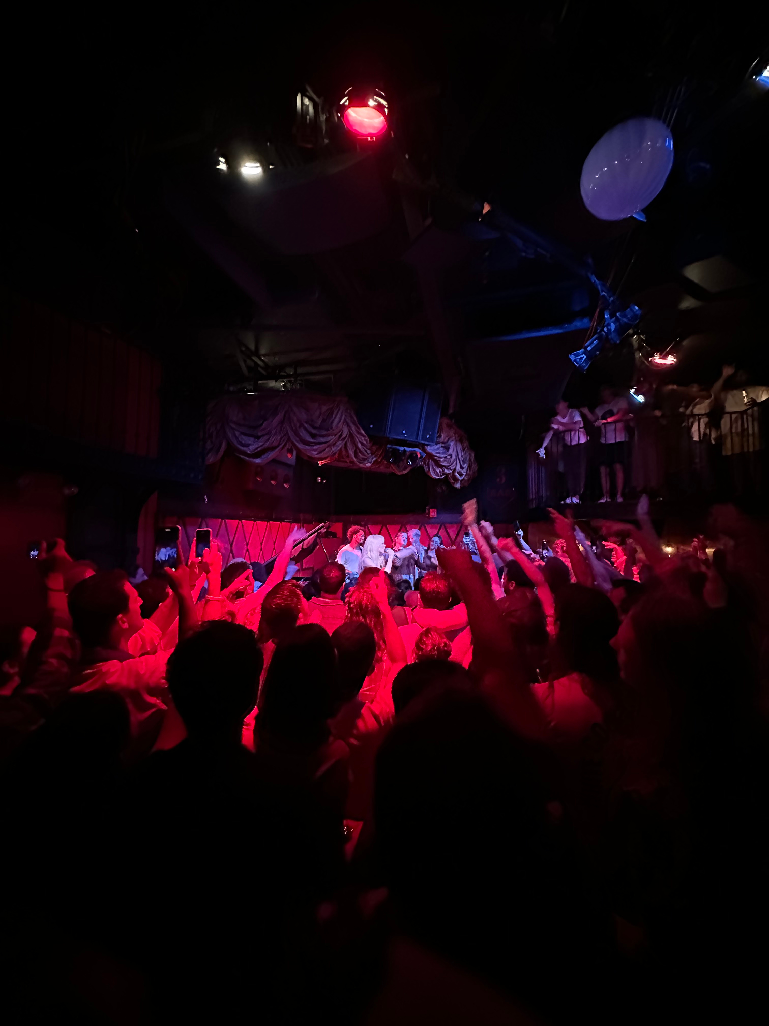 Carly Rae Jepsen performing amid a small crowd