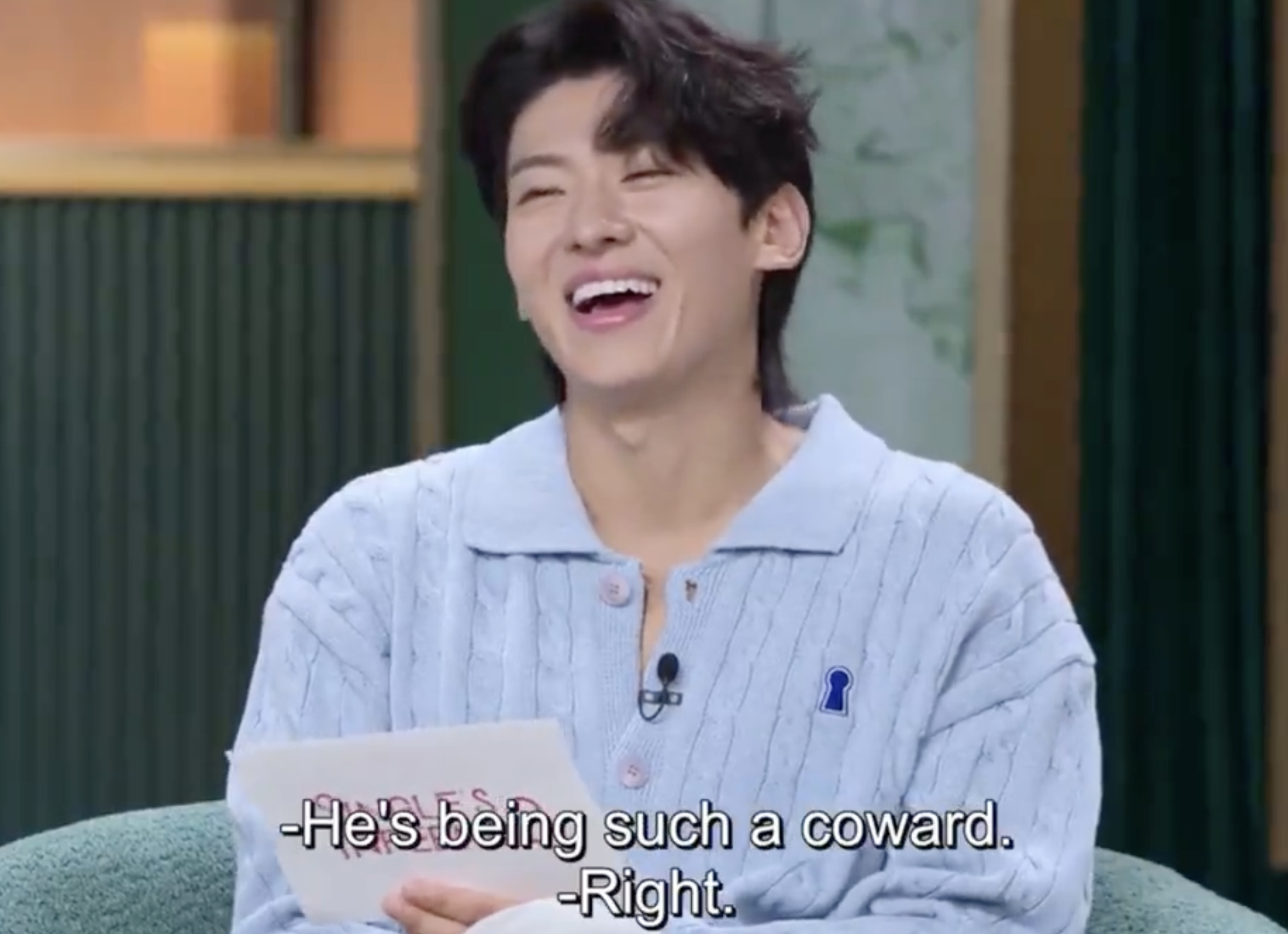 Dex on Singles Inferno 3, laughing. Captions read, "He's being such a coward." "Right."