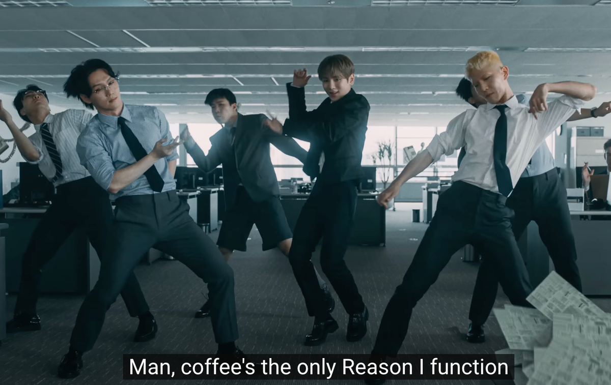 Key and backup dancers in an office as he sings, "Man, coffee's the only Reason I function"