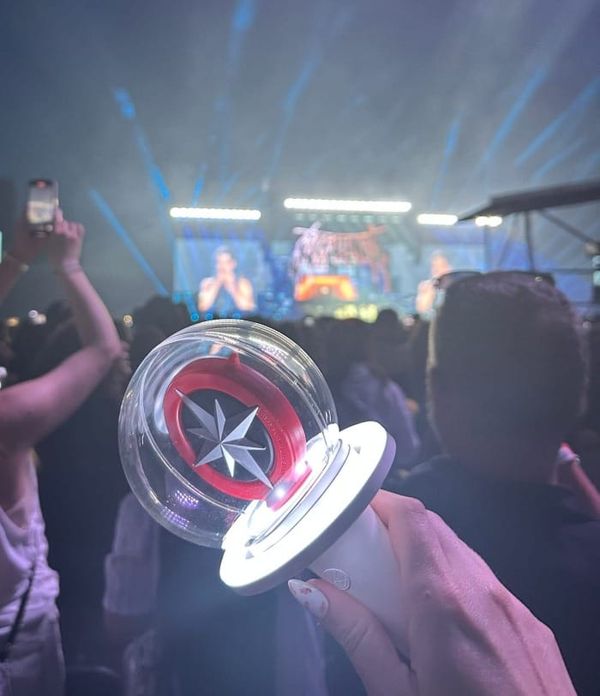 A stray kids lightstick in front of their stage